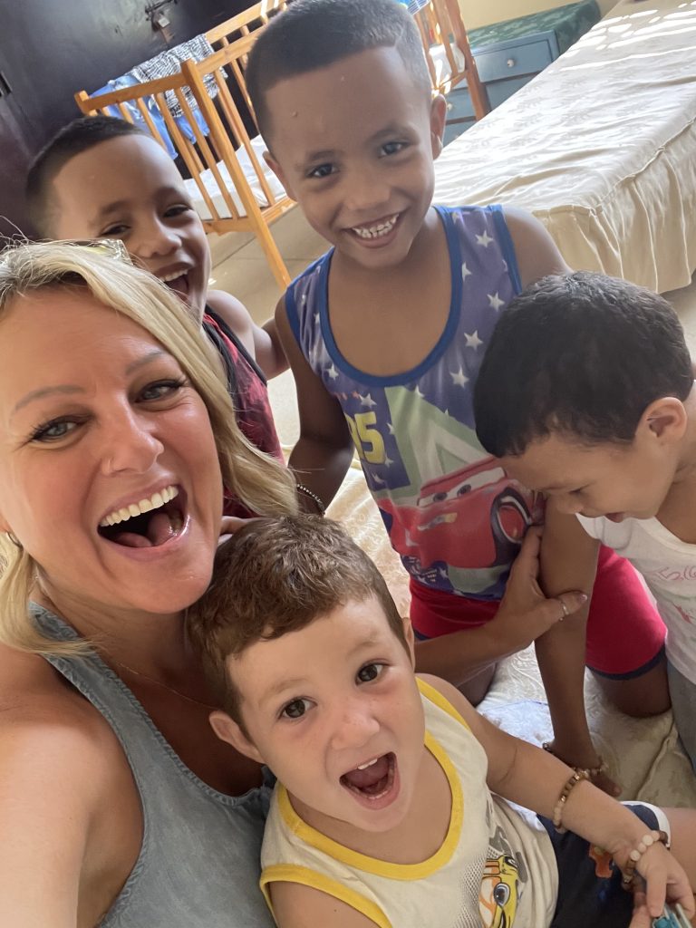 Together For Cuba - Supporting for Cuba's Orphans - Jenn Raymer with smiling Cuban children